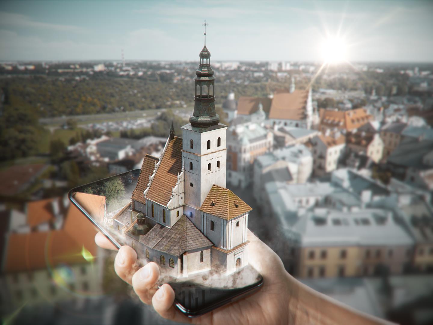 Grafika obrazująca działanie aplikacji Turystyczny Lublin - poglądowe wyłonienie się modelu 3D kościoła farnego z ekranu telefonu